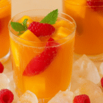 Alt text: Homemade mango iced tea with fresh mangoes and mint